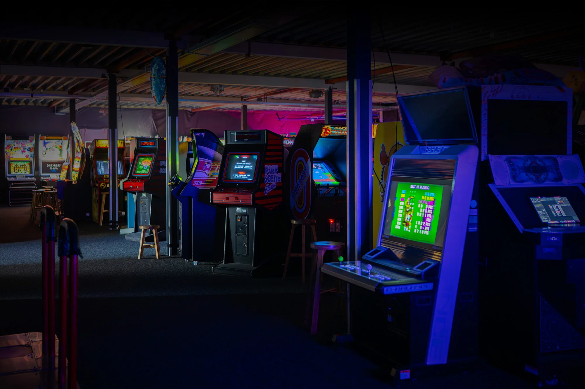 Rows of illuminated arcade cabinets across the Blast Galaxy floor